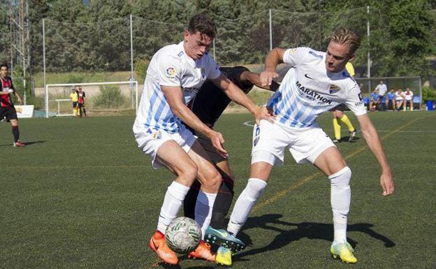 El Atlético Malagueño en un partido contra el Unión Adarve a mediados de junio.