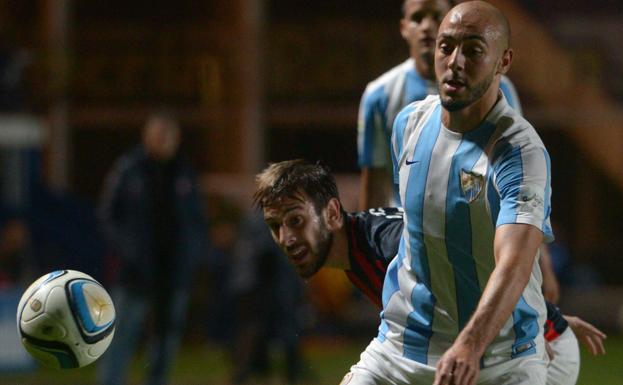 Quignón, en una pugna con Amrabat hace dos veranos.