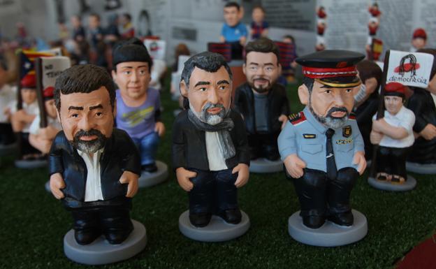 Figuras de Trapero y los 'Jordis'./